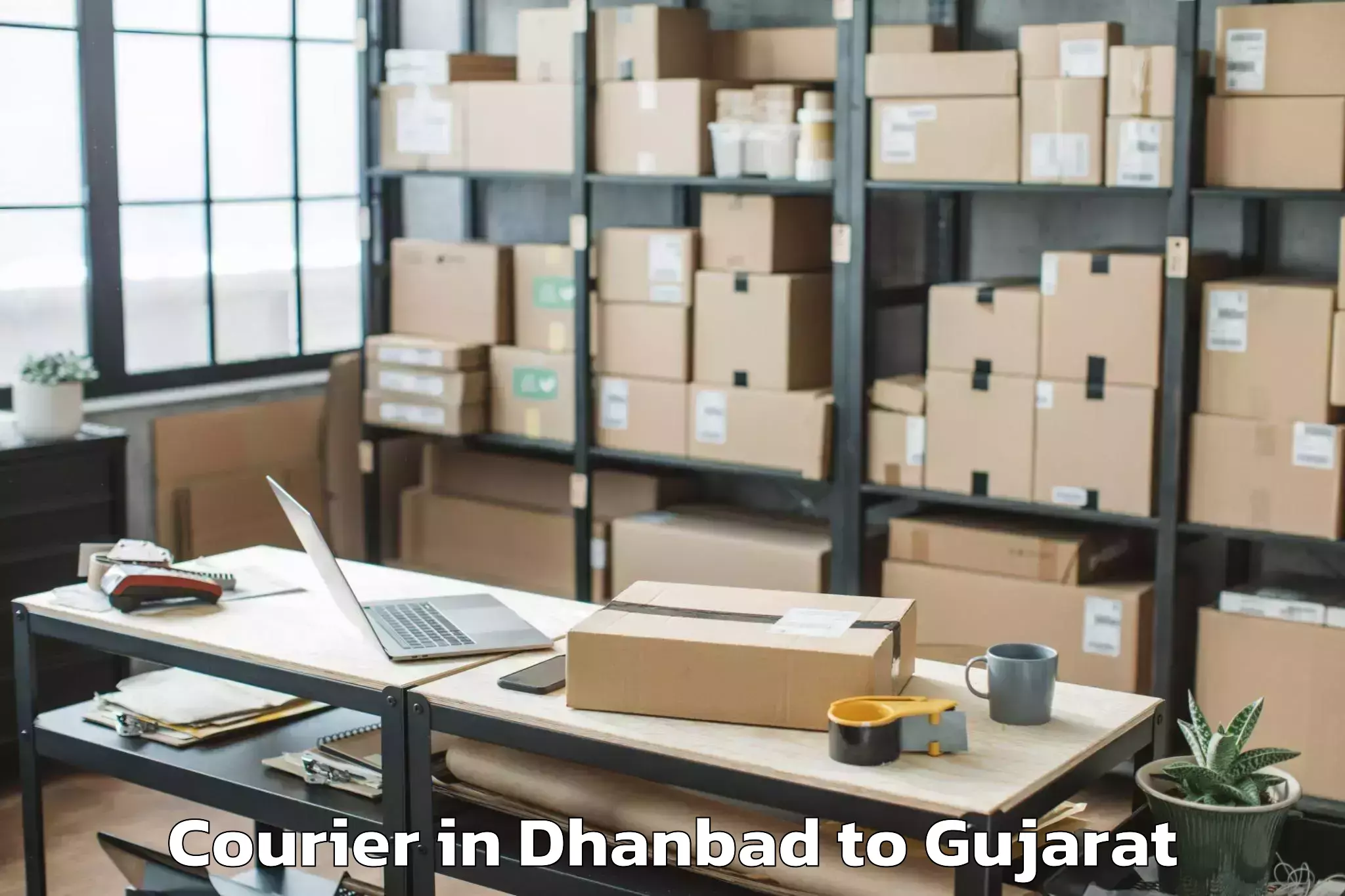 Book Your Dhanbad to Tilakwada Courier Today